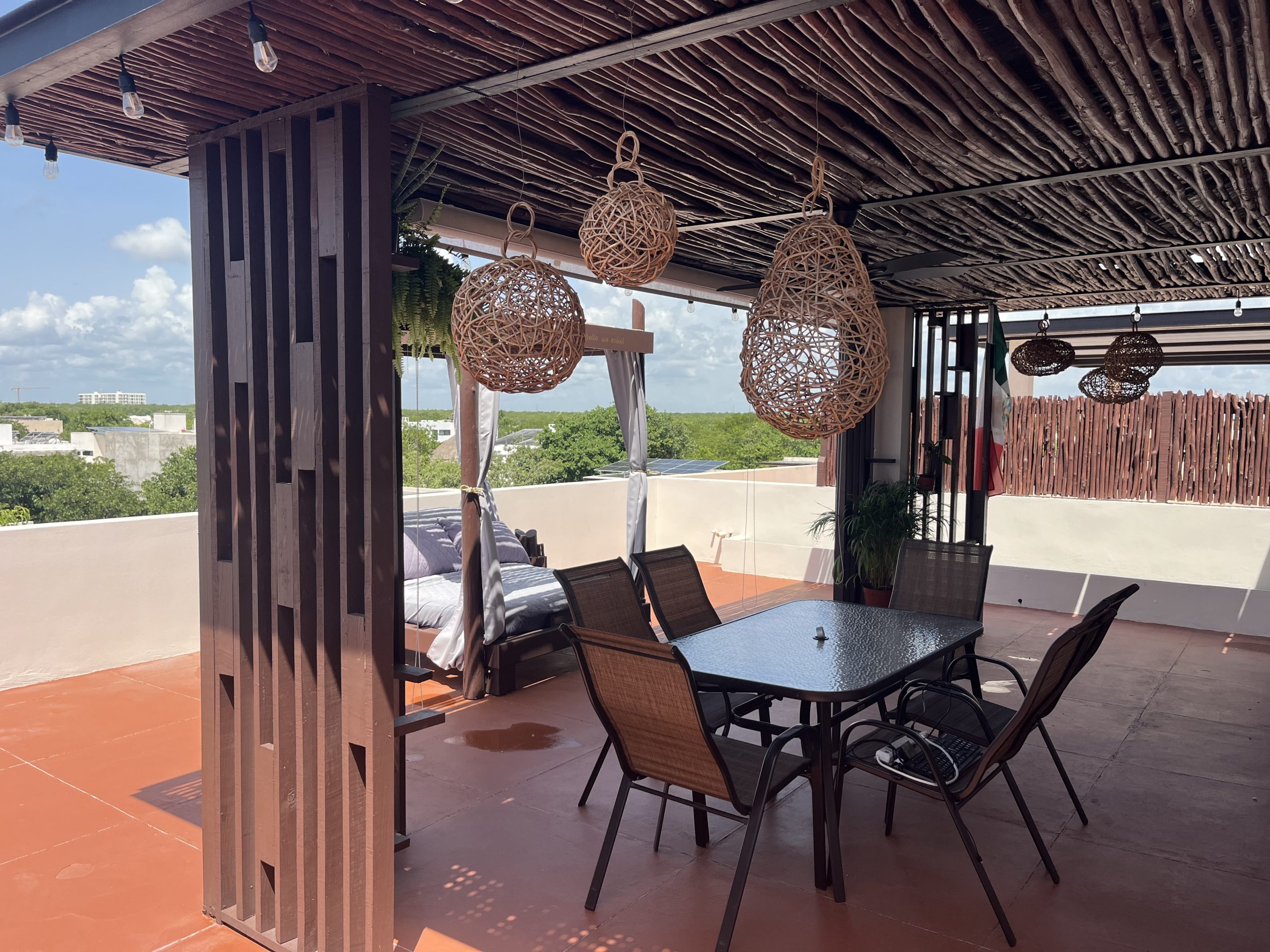 Private rooftop terrace with outdoor lounge area and open views