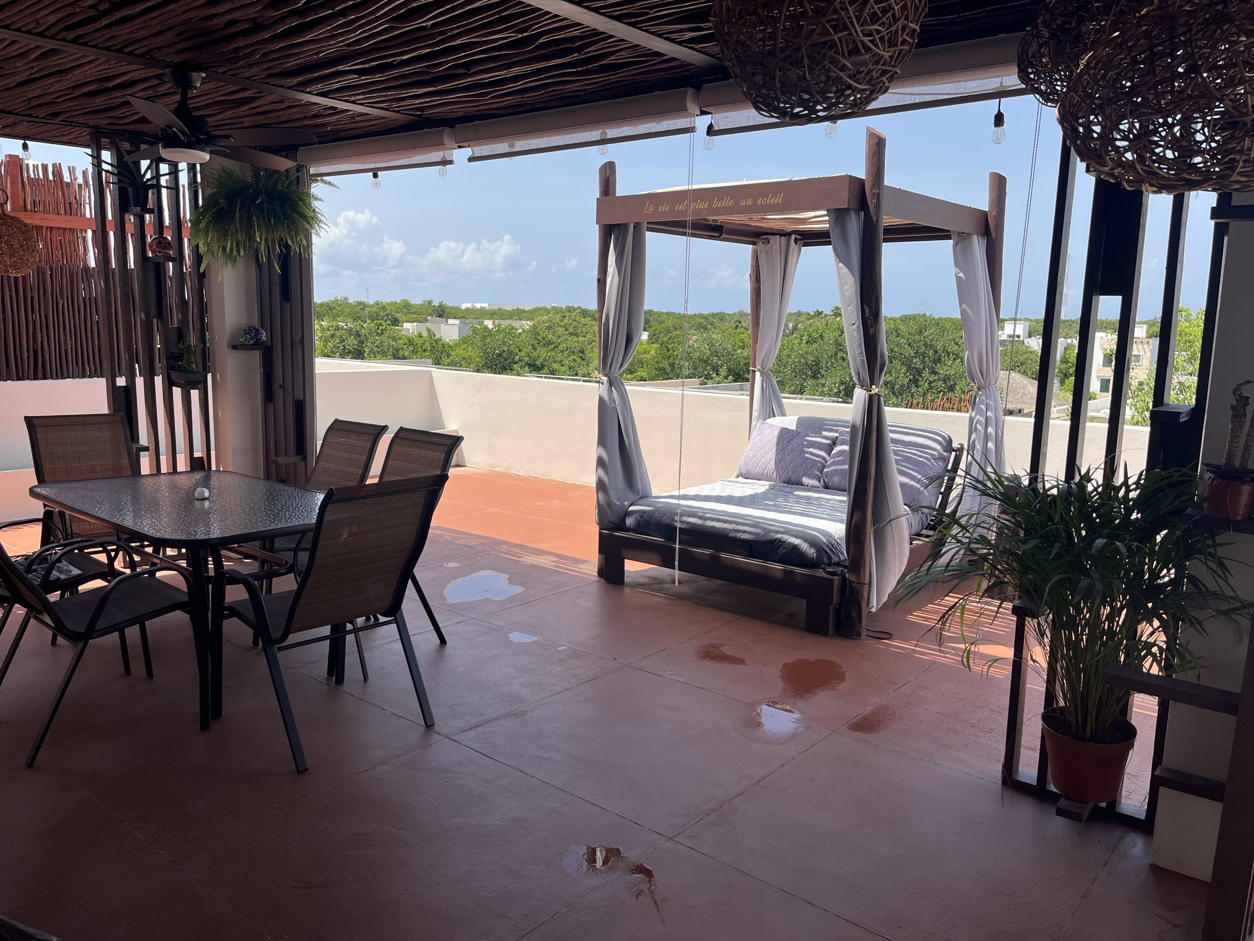 Private rooftop terrace with outdoor lounge area and open views