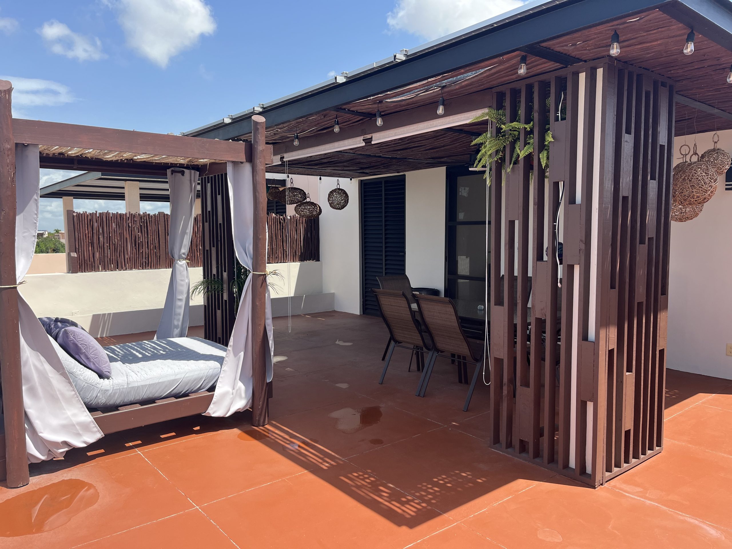 Private rooftop terrace with outdoor lounge area and open views